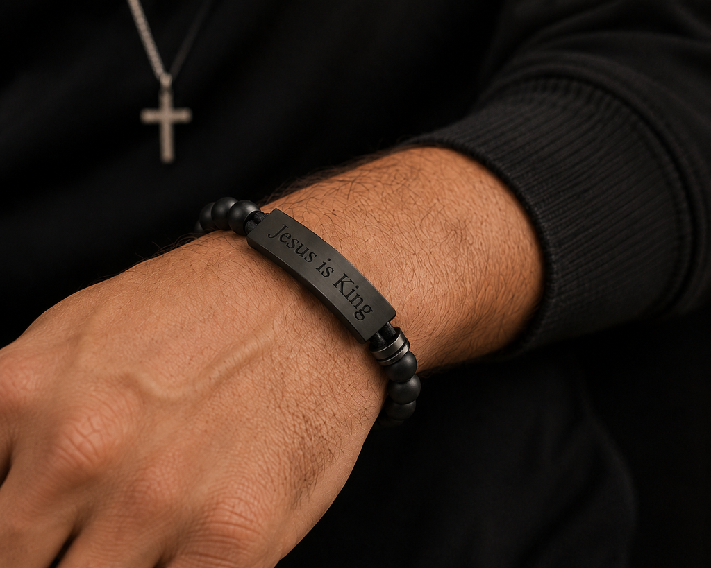 Man wearing the black Jesus Is King Bracelet for Men by Cornerstone